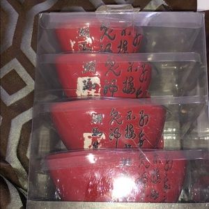 Four piece red ceramic measuring cups